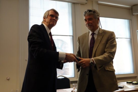 Prof Ed Galea accepting the award from the RINA President